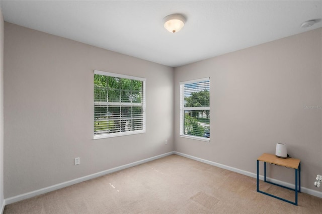 594 Hernando Pl, Clermont, FL 34715 - carpeted empty room featuring baseboards and a smoke detector