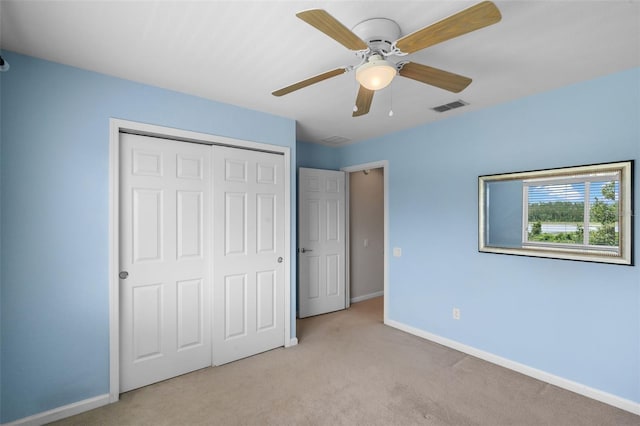 594 Hernando Pl, Clermont, FL 34715 - unfurnished bedroom featuring a closet, carpet floors, and ceiling fan