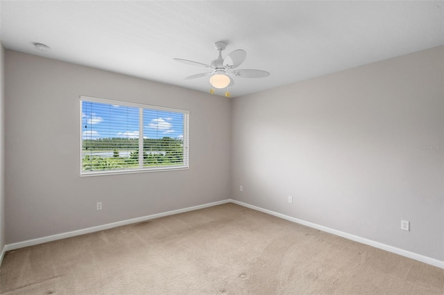 594 Hernando Pl, Clermont, FL 34715 - spare room with light colored carpet and a ceiling fan