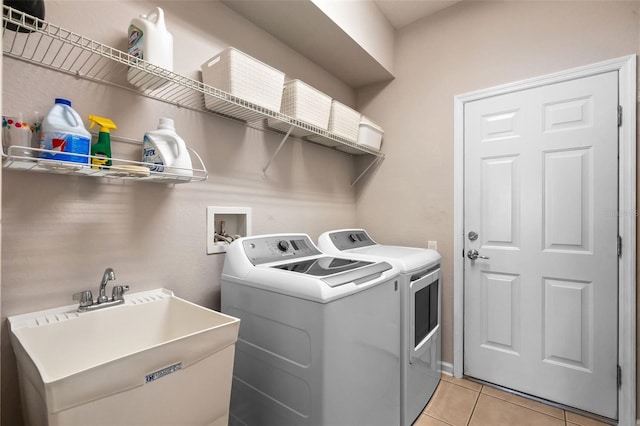 594 Hernando Pl, Clermont, FL 34715 - laundry room with washing machine and clothes dryer and light tile patterned floors