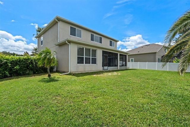 594 Hernando Pl, Clermont, FL 34715 - rear view of house with a sunroom and stucco siding