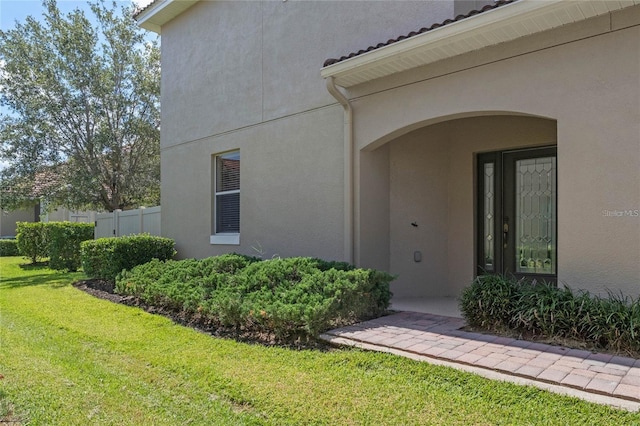 2122 Bent Grass Ave, Ocoee, FL 34761 - entrance to property with a lawn and stucco siding