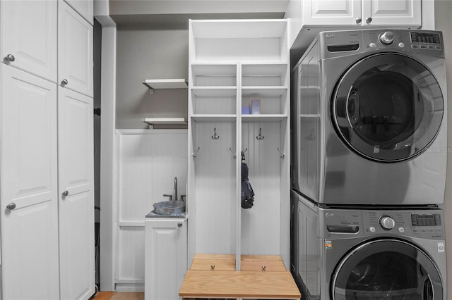 2122 Bent Grass Ave, Ocoee, FL 34761 - laundry room with stacked washing machine and dryer and cabinet space