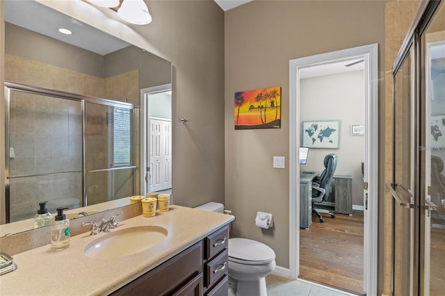 2122 Bent Grass Ave, Ocoee, FL 34761 - full bathroom featuring vanity, a shower stall, and tile patterned flooring