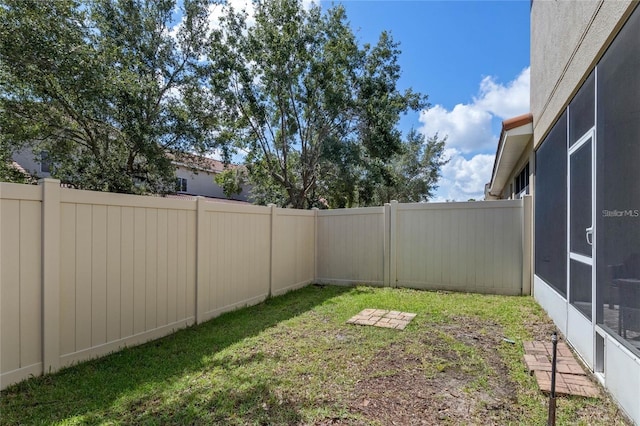 2122 Bent Grass Ave, Ocoee, FL 34761 - fenced backyard with a sunroom
