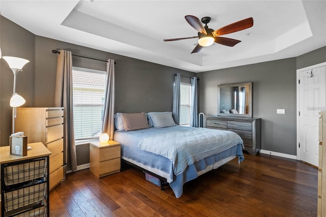2122 Bent Grass Ave, Ocoee, FL 34761 - bedroom with a raised ceiling, hardwood / wood-style floors, and a ceiling fan
