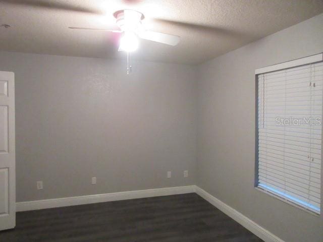 831 Camargo Way Unit 106, Altamonte Springs, FL 32714 - spare room with ceiling fan, dark wood-style flooring, and a textured ceiling