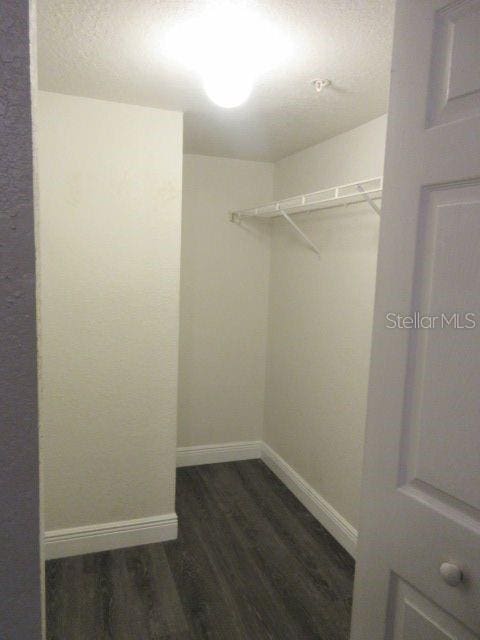 831 Camargo Way Unit 106, Altamonte Springs, FL 32714 - walk in closet with dark wood-style floors