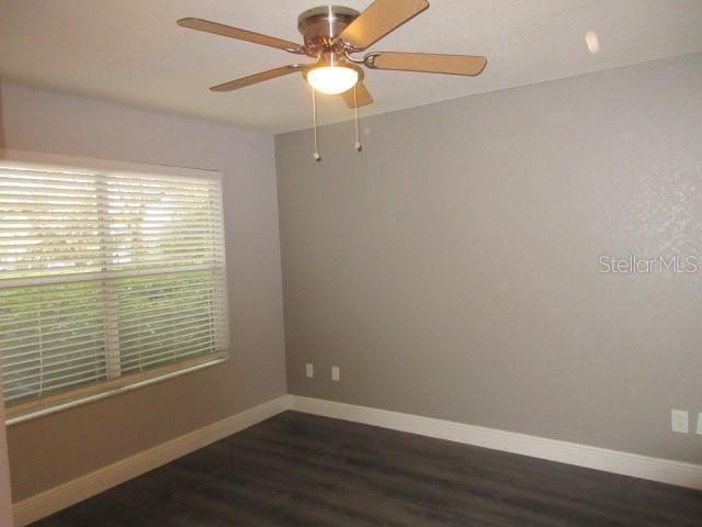 831 Camargo Way Unit 106, Altamonte Springs, FL 32714 - spare room featuring a ceiling fan and dark wood-style floors