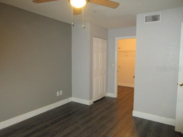 831 Camargo Way Unit 106, Altamonte Springs, FL 32714 - empty room with a ceiling fan and dark wood-style floors
