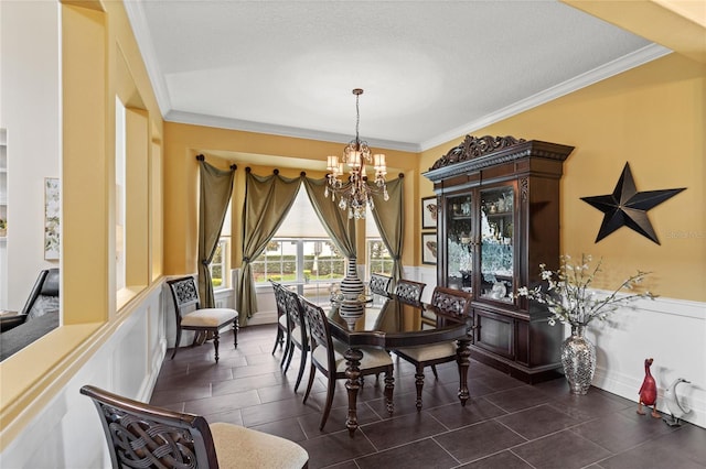 8424 Lake Burden Cir, Windermere, FL 34786 - dining space featuring a chandelier, ornamental molding, and a wainscoted wall