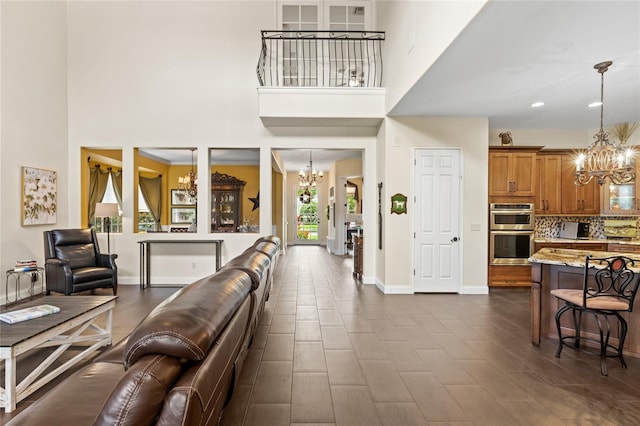 8424 Lake Burden Cir, Windermere, FL 34786 - living area featuring a chandelier and a towering ceiling
