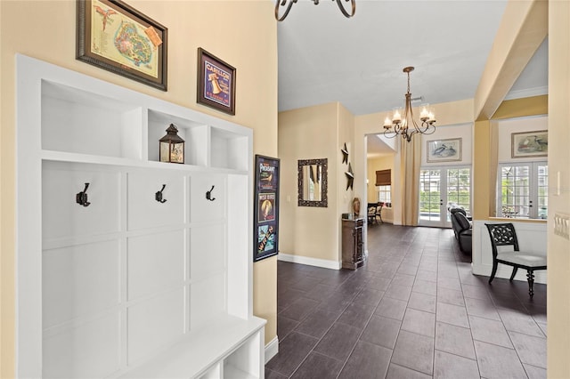 8424 Lake Burden Cir, Windermere, FL 34786 - mudroom with a chandelier and baseboards