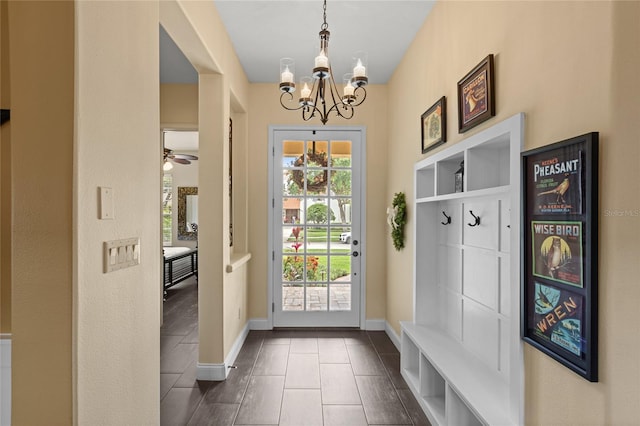 8424 Lake Burden Cir, Windermere, FL 34786 - mudroom featuring a chandelier, dark tile patterned flooring, and ceiling fan