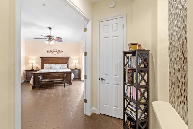 8424 Lake Burden Cir, Windermere, FL 34786 - tiled bedroom with baseboards and crown molding