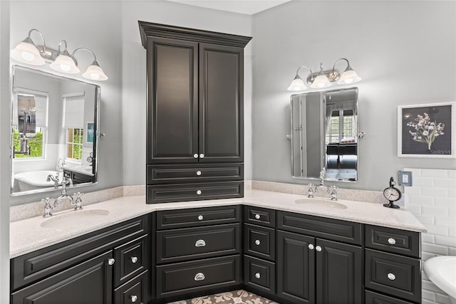 8424 Lake Burden Cir, Windermere, FL 34786 - bathroom featuring double vanity, healthy amount of natural light, and a bath