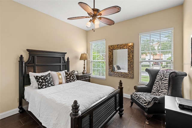 8424 Lake Burden Cir, Windermere, FL 34786 - bedroom featuring multiple windows and a ceiling fan