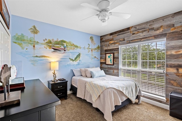 8424 Lake Burden Cir, Windermere, FL 34786 - carpeted bedroom with wood walls, an accent wall, a ceiling fan, and a closet