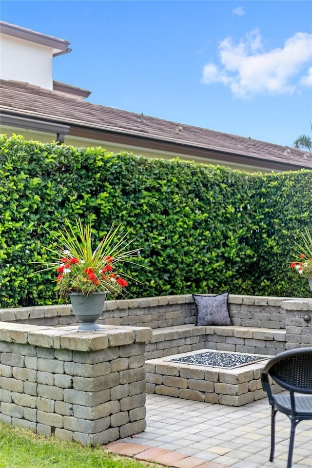 8424 Lake Burden Cir, Windermere, FL 34786 - wooden terrace featuring an outdoor fire pit and a patio