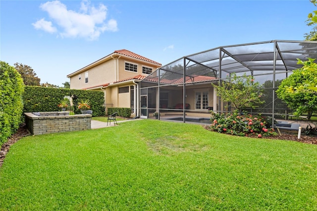8424 Lake Burden Cir, Windermere, FL 34786 - rear view of house featuring a patio area, a yard, stucco siding, and a tiled roof