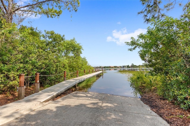 8424 Lake Burden Cir, Windermere, FL 34786 - dock featuring a boat ramp and a water view