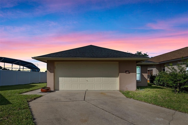 851 Bates Ct, Casselberry, FL 32707 - view of home's exterior featuring stucco siding, concrete driveway, roof with shingles, and a garage