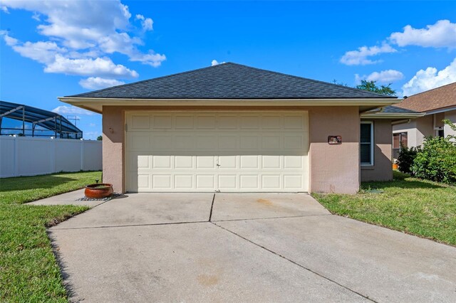 851 Bates Ct, Casselberry, FL 32707 - view of front facade featuring stucco siding, a shingled roof, driveway, and a garage