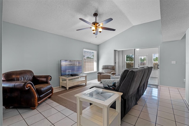 851 Bates Ct, Casselberry, FL 32707 - living room with light tile patterned floors, ceiling fan, lofted ceiling, and a textured ceiling