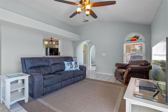 851 Bates Ct, Casselberry, FL 32707 - tiled living area with arched walkways, lofted ceiling, and a ceiling fan