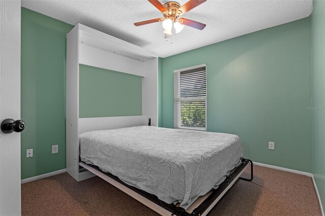 851 Bates Ct, Casselberry, FL 32707 - carpeted bedroom featuring a textured ceiling and a ceiling fan