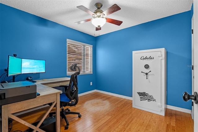 851 Bates Ct, Casselberry, FL 32707 - home office featuring wood finished floors, ceiling fan, and a textured ceiling