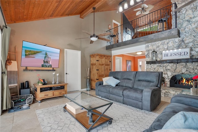 1035 Paladin Ct, Orlando, FL 32812 - living room featuring wood ceiling, a ceiling fan, tile patterned floors, high vaulted ceiling, and a fireplace