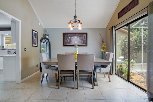 1035 Paladin Ct, Orlando, FL 32812 - dining area with vaulted ceiling, a chandelier, and light tile patterned flooring
