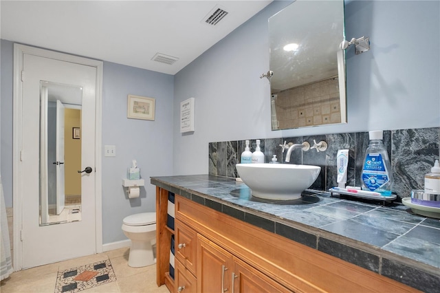 1035 Paladin Ct, Orlando, FL 32812 - bathroom with vanity, tasteful backsplash, and tile patterned flooring