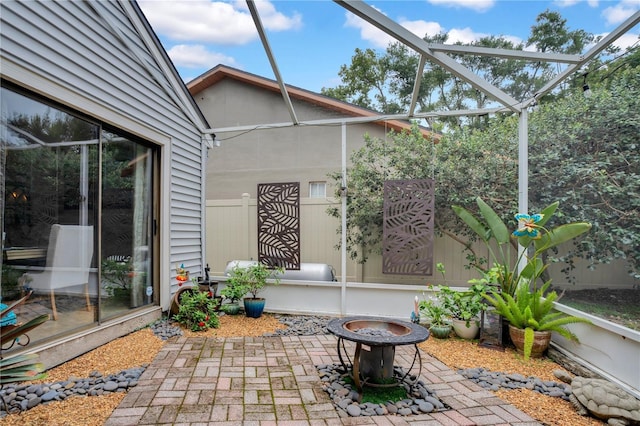 1035 Paladin Ct, Orlando, FL 32812 - view of patio featuring an outdoor fire pit and a lanai