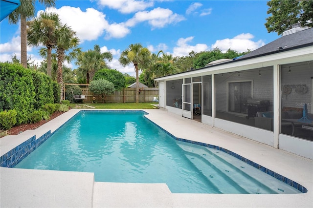 1035 Paladin Ct, Orlando, FL 32812 - view of pool featuring a sunroom and a fenced backyard