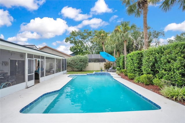 1035 Paladin Ct, Orlando, FL 32812 - view of swimming pool featuring a sunroom and a fenced backyard
