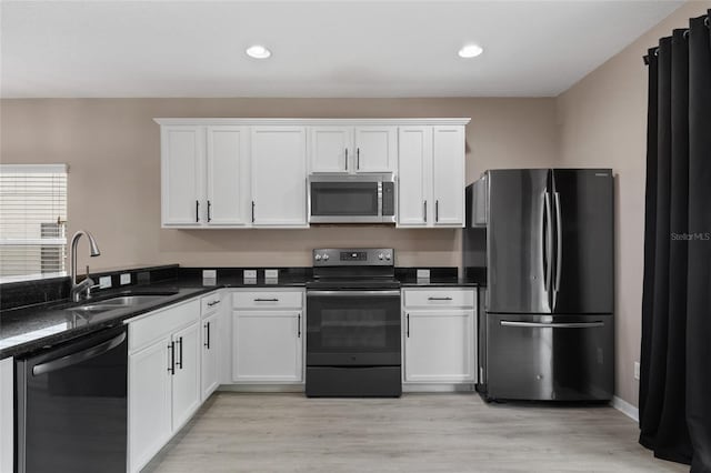 1030 Bending Oak Trl, Winter Garden, FL 34787 - kitchen with stainless steel appliances, white cabinets, dark countertops, and recessed lighting