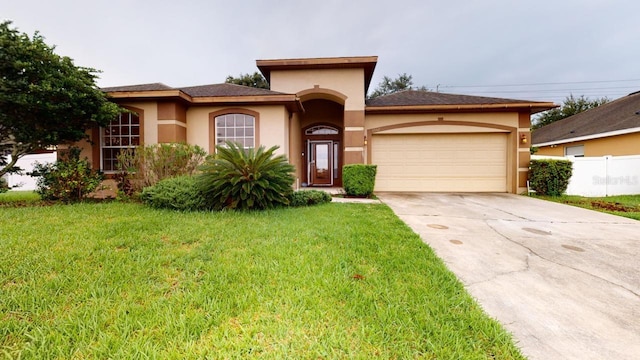 3552 Macauley Ct, Ocoee, FL 34761 - view of front of home featuring an attached garage, driveway, and stucco siding
