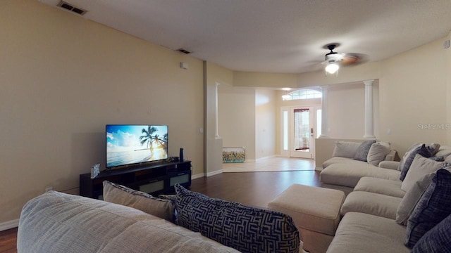 3552 Macauley Ct, Ocoee, FL 34761 - living area featuring wood finished floors, ceiling fan, and ornate columns