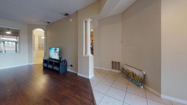 3552 Macauley Ct, Ocoee, FL 34761 - unfurnished room with ornate columns, wood finished floors, and arched walkways