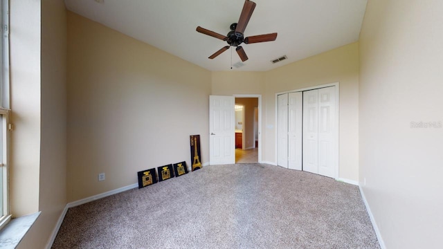 3552 Macauley Ct, Ocoee, FL 34761 - unfurnished bedroom with carpet flooring, a closet, and a ceiling fan