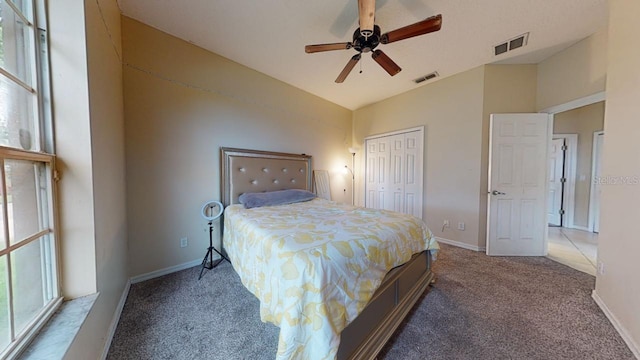 3552 Macauley Ct, Ocoee, FL 34761 - carpeted bedroom featuring multiple windows, lofted ceiling, a closet, and ceiling fan