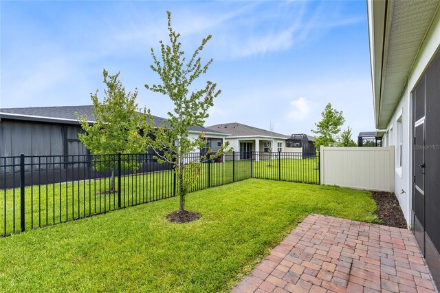 2302 Datura Loop, Saint Cloud, FL 34772 - fenced backyard featuring a patio