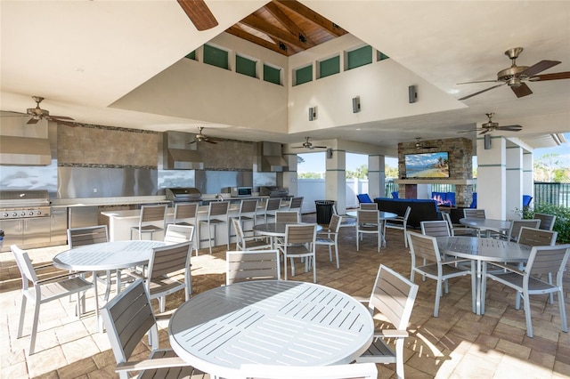 2302 Datura Loop, Saint Cloud, FL 34772 - view of patio with an outdoor kitchen, ceiling fan, and outdoor dining space