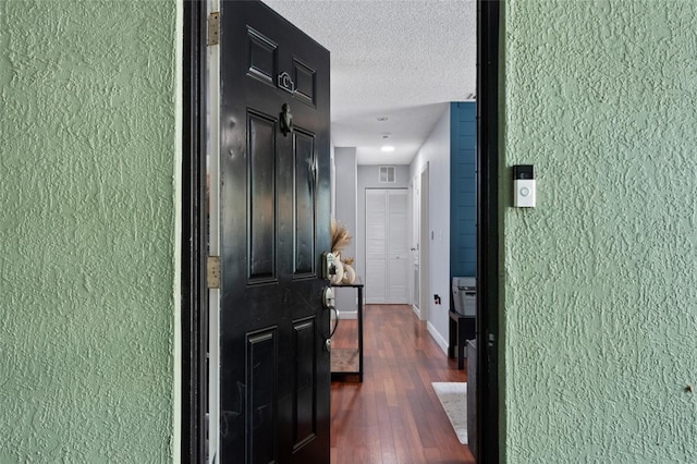 2035 Dixie Belle Dr Unit 2035C, Orlando, FL 32812 - hall with wood finished floors, a textured wall, and a textured ceiling