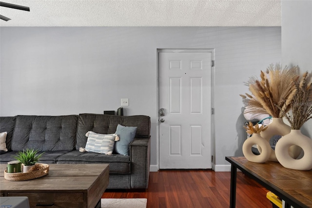 2035 Dixie Belle Dr Unit 2035C, Orlando, FL 32812 - living room with dark wood-type flooring and a textured ceiling
