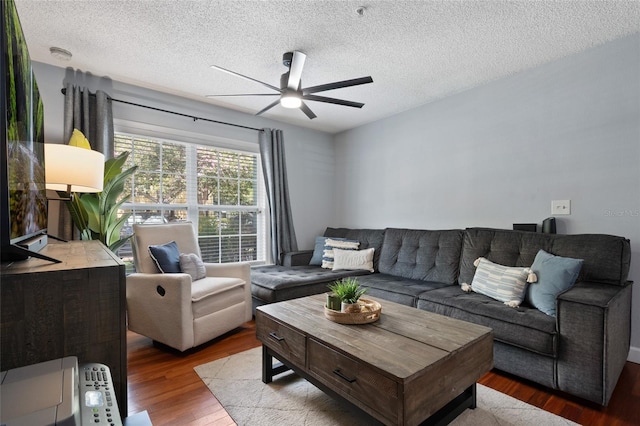 2035 Dixie Belle Dr Unit 2035C, Orlando, FL 32812 - living area with a ceiling fan, wood finished floors, and a textured ceiling