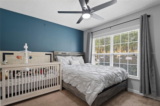 2035 Dixie Belle Dr Unit 2035C, Orlando, FL 32812 - carpeted bedroom with a textured ceiling and ceiling fan