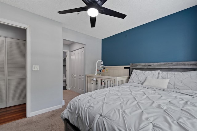 2035 Dixie Belle Dr Unit 2035C, Orlando, FL 32812 - bedroom featuring carpet flooring, a textured ceiling, multiple closets, and ceiling fan